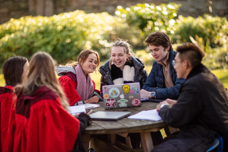 A group of friends having fun after taking the IELTS exam for Canada permanent residency